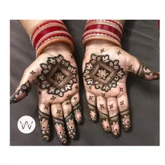 A lovely mandala design created for my mom, perfect for any festive occasion. The red bangles complete the traditional look.