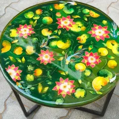 This vibrant lotus pond table is a perfect example of how I turn nature into art. Each lotus flower and koi fish is carefully placed within layers of green-tinted resin to create a sense of depth and tranquility. It’s a functional centerpiece that brings a feeling of peace to your home.