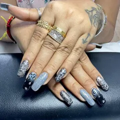 A different view of this dramatic glitter and animal print set, showing how the different elements come together across both hands for a cohesive yet varied look.