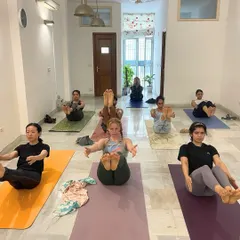 Building core strength together. This group works on Navasana (Boat Pose), a posture that requires focus, strength, and a bit of teamwork to hold. Our sessions are designed to be both challenging and accessible for all levels.