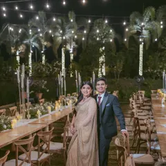 We believe in the magic of intimate moments. This elegant sit-down dinner, set under a canopy of fairy lights, was designed to feel both grand and personal, creating a warm, romantic atmosphere for an evening of heartfelt conversations.