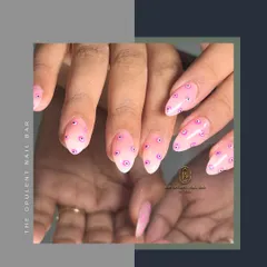Pretty in pink with a touch of protection. This evil eye nail art combines a soft aura base with delicate purple evil eye symbols for a trendy and meaningful design.
