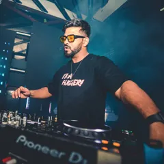 In the zone, mixing tracks at the console. This is where I blend my love for Bollywood with deep house and techno, creating a sound that's completely my own.
