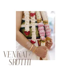 A detail shot of the groom's attire and the beautiful floral garlands (Varmala). The clean, minimalist presentation turns these traditional elements into a piece of modern art.