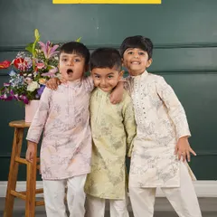 I love seeing the playful energy of little boys, and I design my kurta sets to match it. Here you can see a few of my printed designs in soft pink, pastel green, and off-white, all made from breathable fabrics that are perfect for parties and family photos.