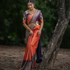 A full-length view of the orange and purple saree, showcasing its beautiful drape and unique color combination.