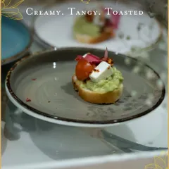 A modern classic, our avocado cream cheese toast is a fresh and vibrant appetizer. The creamy avocado and tangy cheese on a crisp toast point make for a perfect welcome bite at any elegant event.