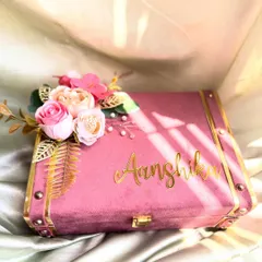 A personalized velvet trunk box, custom-made for Aanshika. The gold lettering and floral accent make this a luxurious keepsake box for her to store her treasures.