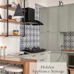 This kitchen features a hidden appliance garage, perfect for keeping toasters and coffee makers out of sight. This is one of my five must-have features for a functional Indian kitchen.