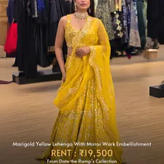 A marigold yellow lehenga with stunning mirror work embellishment. This is a true statement piece.