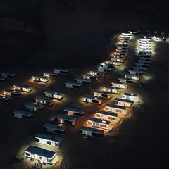 An impressive aerial view of a modular hotel built in the desert using our Space Capsule E8 units. This demonstrates our capability to execute large-scale, complex projects in any environment.