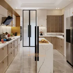 This spacious kitchen features a stunning marble island that doubles as a prep area and breakfast counter. The combination of warm wood-toned and white cabinets creates a balanced and inviting atmosphere.