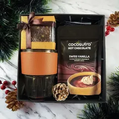 The "Warm Wishes" hamper is another perfect cozy gift for the holiday season, containing hot chocolate, a brownie, and a leather-sleeved glass.