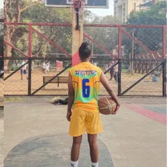 Wearing the Maharashtra jersey with pride. This shot from behind shows the name of the state she represents, a goal for many young players who join my basketball coaching programs.