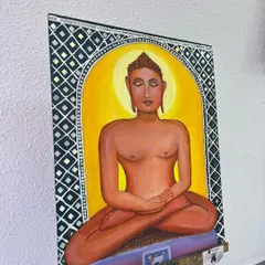 This painting of Lord Mahavir is a fusion of three art forms I love: acrylics, Lippan art, and Mandala. I carefully combined these techniques to create a piece that is both spiritually significant and visually intricate. The mirrored Lippan border adds a unique, reflective quality to the artwork.