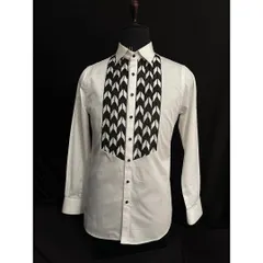 For a more modern and graphic look, I designed this white tuxedo shirt with a bold black-and-white chevron-patterned bib. It’s a statement piece that adds an artistic touch to your formal attire.
