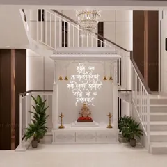This modern Pooja room, crafted from pure white Corian, shows how sacred spaces can be both serene and contemporary. The backlit Sanskrit mantras and intricate jali work create a tranquil atmosphere for prayer and reflection.