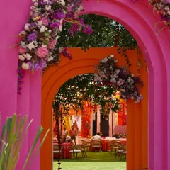 Haldi celebrations should be an explosion of joy and color. We crafted these vibrant pink and orange arches, adorned with lush floral arrangements, to create a picture perfect, fun-filled entrance that feels both festive and deeply personal.