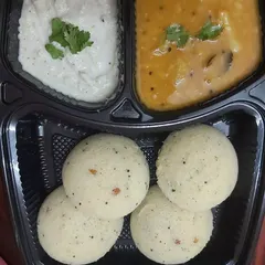 Start your day right with our authentic South Indian breakfast options. This meal box contains soft, fluffy idlis served with classic coconut chutney and aromatic sambar, delivered fresh from a home kitchen to your doorstep.