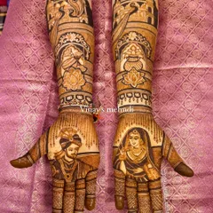 This royal bridal mehndi tells a complete story with portraits of the couple on the palms and various traditional wedding symbols like the kalash and palace motifs on the arms.
