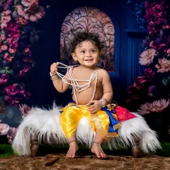 Little Krishna, big blessings. This elaborate floral backdrop creates a truly magical setting for our Krishna theme.
