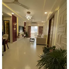 I design open, flowing spaces where life can unfold beautifully. This expansive living and dining area combines modern luxury with comfortable living, featuring a rich color palette, statement lighting, and custom wall textures to create a truly impressive and welcoming atmosphere.