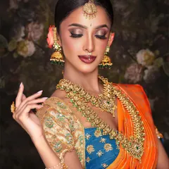 A closer look at the artistry of my temple jewelry collection. This set features traditional motifs and is studded with green and ruby-colored Kemp stones, paired with large jhumkas and a maang tikka, perfect for achieving an authentic and vibrant bridal look.