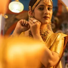 An artistic shot of the bride looking into a mirror, perfect for a wedding album.