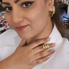 White is my power game. Here I am styling a crisp white blazer with our bold, multi-hoop gold-tone earrings and a matching ring for a look that is both powerful and chic.