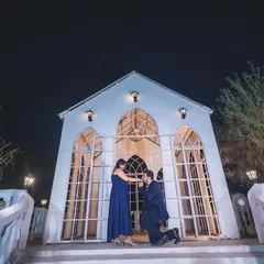 A perfect proposal shot captured at our signature white chapel set. This angle showcases the full grandeur of the backdrop, making it an ideal spot for capturing key moments in your love story.