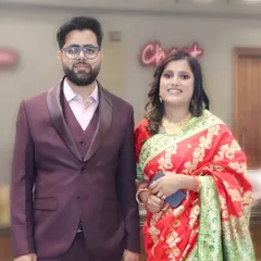 A formally dressed couple posing for a portrait at an event, showcasing my ability to capture sharp, elegant photos.