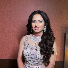 An elegant reception look for a lovely client. I opted for soft, romantic curls and a makeup look that enhanced her features with a pop of color on the lips and shimmering eyes.