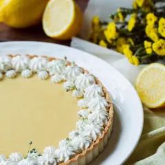 My classic Lemon Tart combines a buttery, flaky crust with a smooth, zesty lemon curd filling, all topped with delicate meringue kisses.