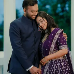 An intimate portrait of the couple. The bride's hair is styled in soft waves, and her makeup is elegant and understated, ideal for a romantic photoshoot.