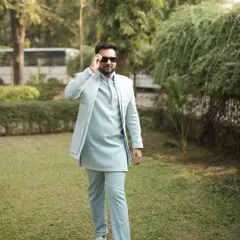 Dressed to impress without the stress. Our client rocks this stylish pastel blue open jacket Indo-Western outfit for his special occasion.