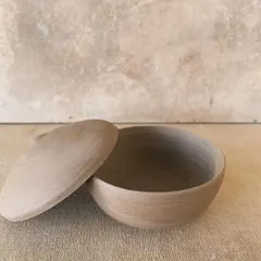 A raw, unglazed lidded jar, wheel-thrown and trimmed to perfection. I love the simplicity of these forms, where the beauty of the natural clay is the main focus.