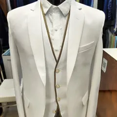 A crisp white three-piece suit on display in our studio.
