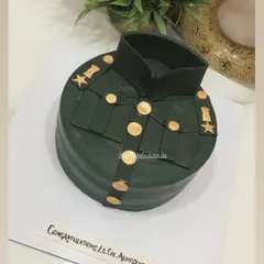 A top-down view of the army promotion cake, showing the uniform's stars and medals.