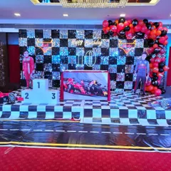 This Formula 1 racing theme was a huge hit, featuring a checkered sequin backdrop, a winner's podium, and custom cutouts. I love bringing high energy themes like this to life for birthdays.
