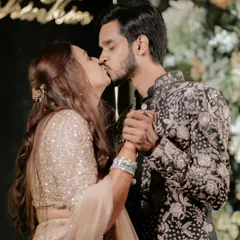 A kiss that seals the promise. This intimate moment between Karan and Vrinda at their engagement party captures the culmination of a love story that began at a Coldplay concert.