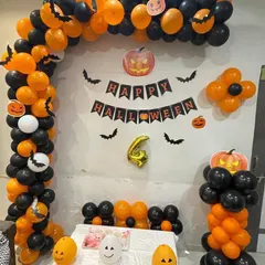 Our fun Halloween party setup, designed with a striking orange and black balloon arch. We included a 'Happy Halloween' banner, bat cutouts, and friendly pumpkin characters to create a festive and cheerful atmosphere for all ages.