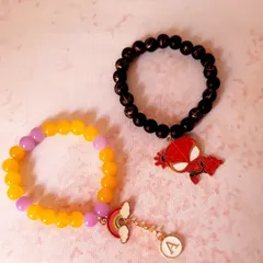A perfect pair for the perfect siblings. These custom bracelets were made for Rakhi, one with a Spider-Man charm and the other with a rainbow and initial charm.