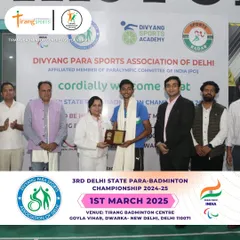 An award ceremony during the para-badminton championship, with Member of Parliament Smt. Kamaljeet Sehrawat felicitating a player.