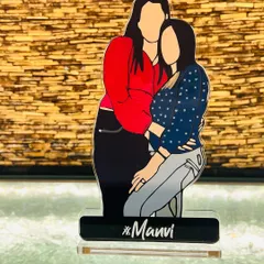 A beautiful custom acrylic standee featuring an illustration of two friends or sisters. The name 'Manvi' is personalized on the base, making it a unique and heartfelt gift that celebrates a special bond.