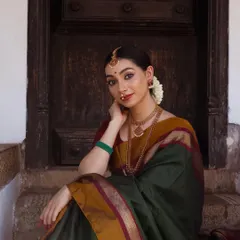 I have a deep passion for heritage jewelry, and this shoot allowed me to embody a classic South Indian aesthetic. The focus here was on showcasing the intricate details of the temple jewelry and the rich texture of the silk saree, creating a timeless bridal or festive look.
