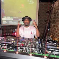 Behind the decks at a club night, bringing the energy. This is my element, controlling the sound and the mood.