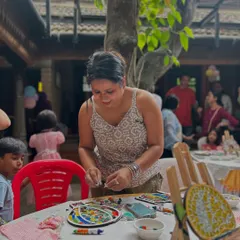 Here I am at a party, helping the kids get started on their mosaic art. I provide a wide range of colorful tiles so they can let their imaginations run wild.