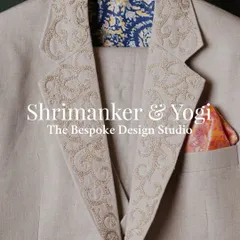 A closer look at the details that make our designs unique. This Indo-Western jacket features exquisite lapel embroidery, a vibrant pocket square, and a contrasting patterned lining.