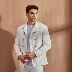 I believe you can never go wrong with a white denim-on-denim look. This double-breasted shacket offers a structured, sophisticated take on a classic casual style.