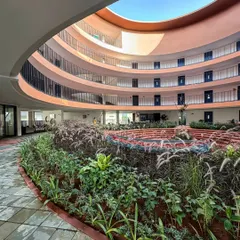 At the core of the school, a circular courtyard with lush, tiered gardens serves as a biophilic sanctuary. This space embodies our commitment to creating environments that foster community and connect occupants with nature, enhancing the daily learning experience.